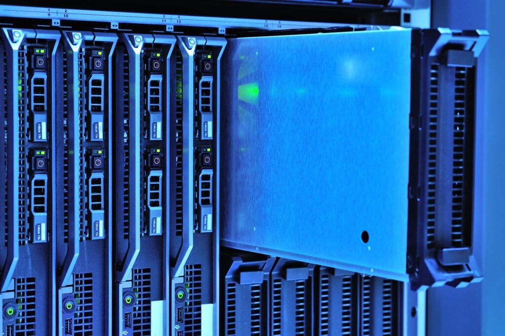 Rack-mounted server units lit with blue light in a data center