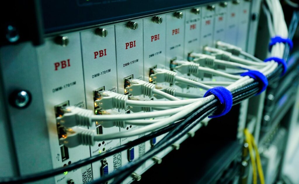 Ethernet cables connected to a network switch panel
